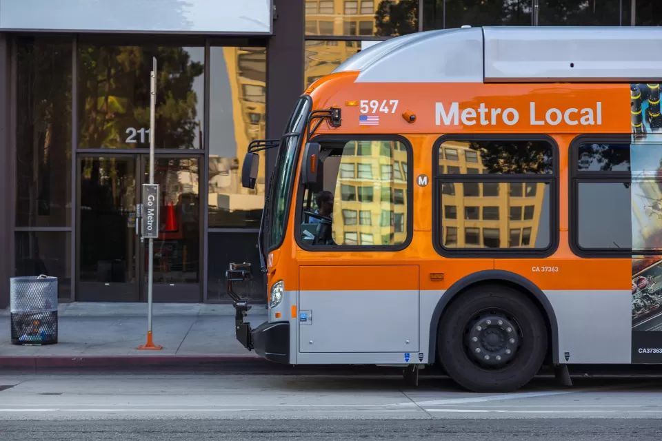 Orange Los Angeles Metro bus on city street
